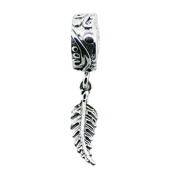 Silver fern leaf charm on cylinder bead 