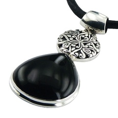 Silver pendant with black agate and figured disc 
