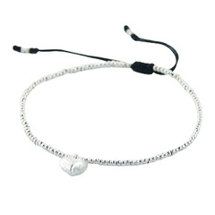 Tiny silver beads on macrame bracelet with puffed heart charm 
