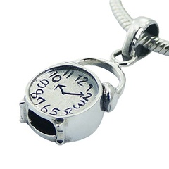 Little silver alarm clock with antique finish in details 