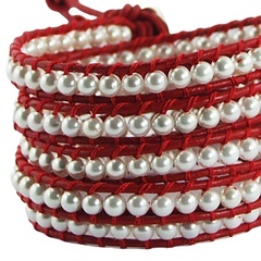 Five rows wrap bracelet with imitation pearls on red leather 